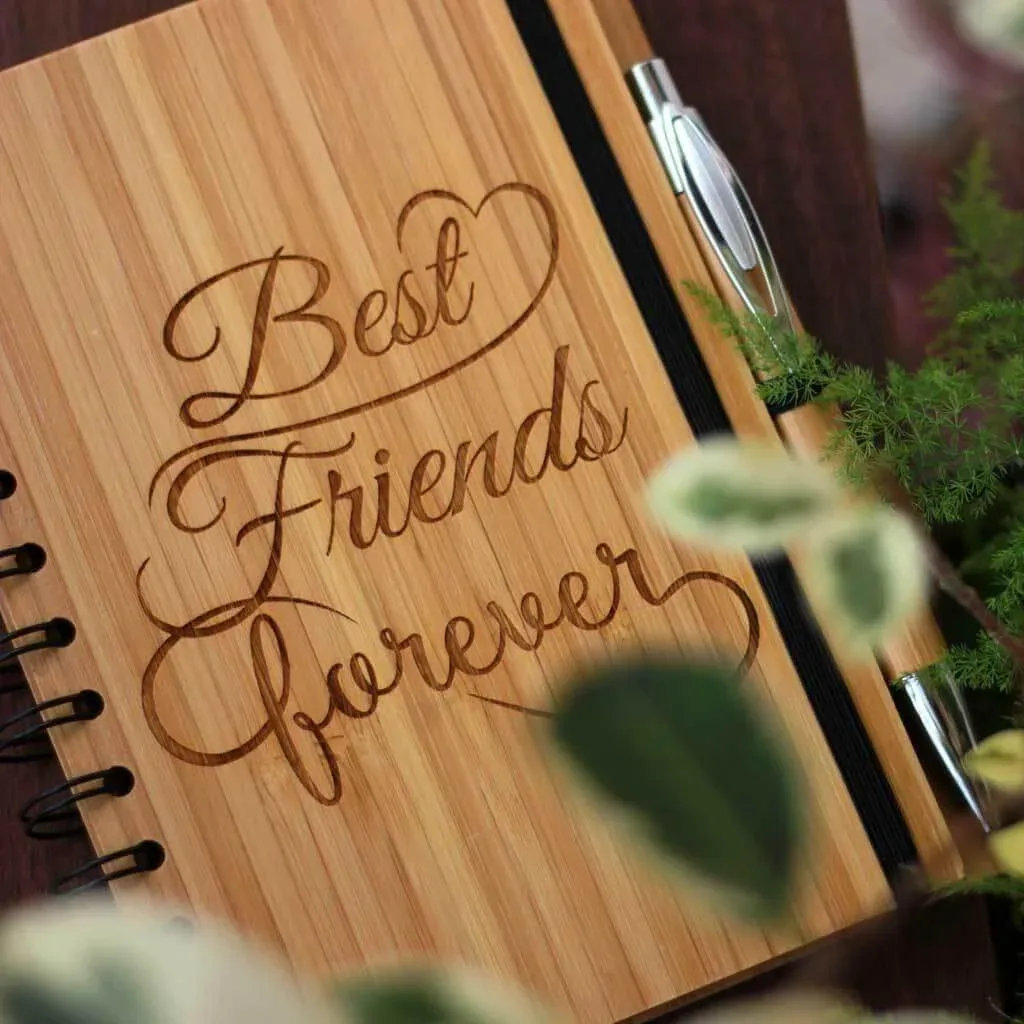 A journal with pen where Best Friends forever inscribed on the cover