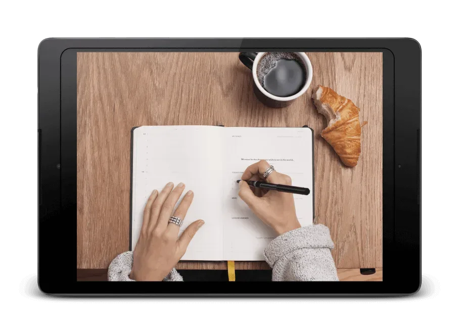 A person writing in a diary